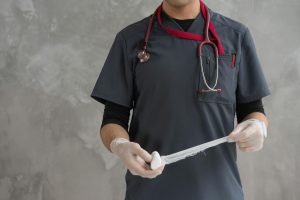 person holding a rolled gauze